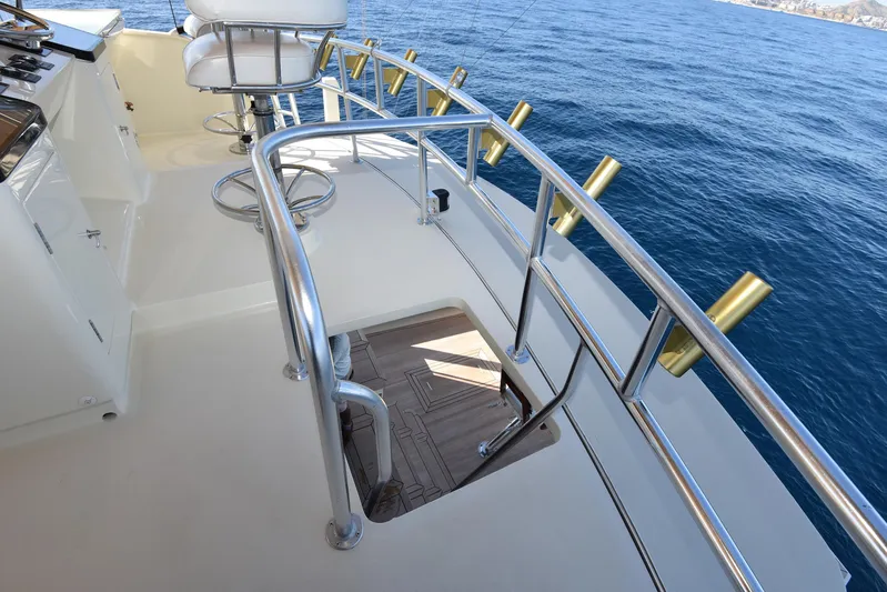 Talisman Yacht Photos Pics Striker 62 Convertible 1989 yacht deck with seating and ocean view.