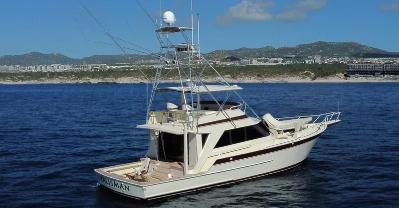 Talisman Yacht Photos Pics 1989 Striker 62 Convertible yacht on open sea.