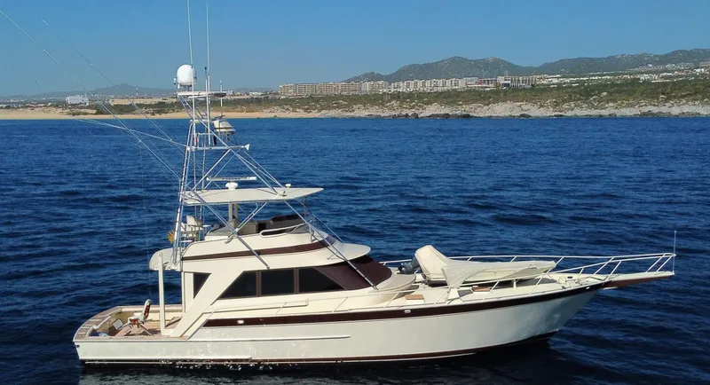 Talisman Yacht Photos Pics 1989 Striker 62 Convertible Yacht on open sea.