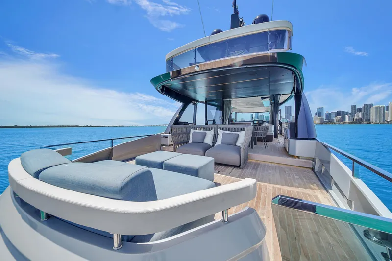  Yacht Photos Pics Luxurious 2021 Explorer 62 yacht with spacious deck, modern seating, and stunning ocean view.