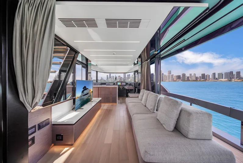  Yacht Photos Pics Luxurious interior of 2021 Explorer 62 yacht with panoramic ocean views and modern furnishings.