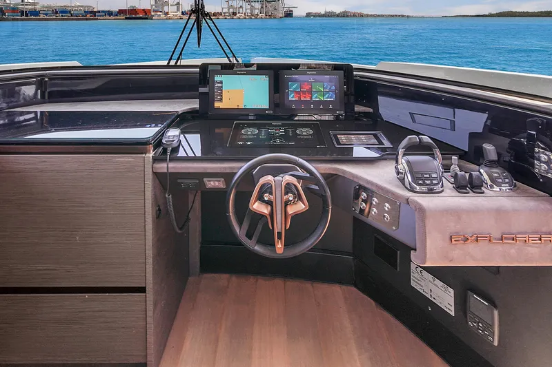  Yacht Photos Pics 2021 Explorer 62 yacht helm with modern navigation systems and ocean view.