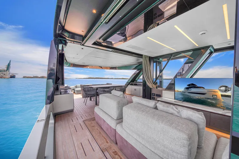  Yacht Photos Pics Luxurious 2021 Explorer 62 yacht interior with plush seating and ocean view.