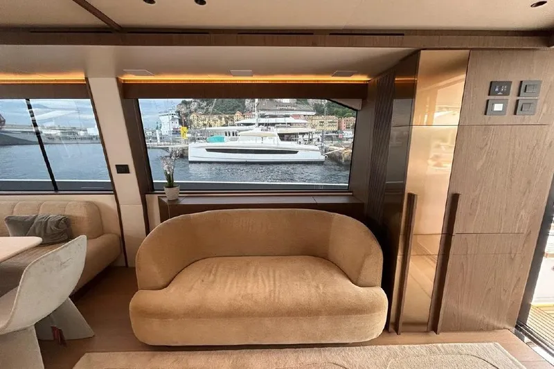  Yacht Photos Pics Luxurious interior of 2024 Azimut Fly 72 yacht with elegant seating and scenic window view.
