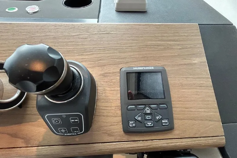  Yacht Photos Pics Control panel of 2024 Azimut Fly 72 yacht with joystick and display.