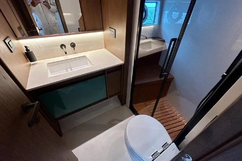  Yacht Photos Pics Luxurious bathroom interior of 2024 Azimut Fly 72 yacht, featuring modern fixtures and elegant design.