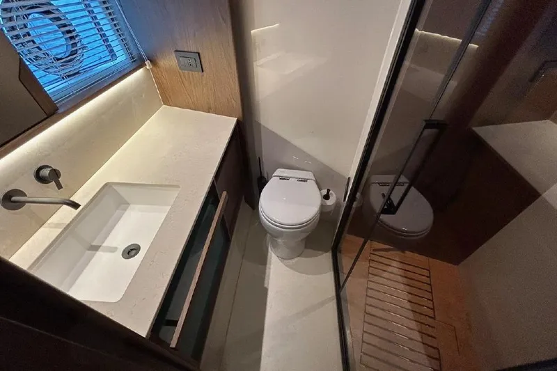  Yacht Photos Pics Luxurious bathroom in 2024 Azimut Fly 72 yacht with modern fixtures and elegant design.
