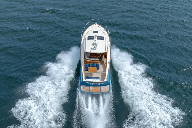 The Do-over Yacht Photos Pics 2024 Hinckley Picnic Boat 40 cruising on open water, aerial view.