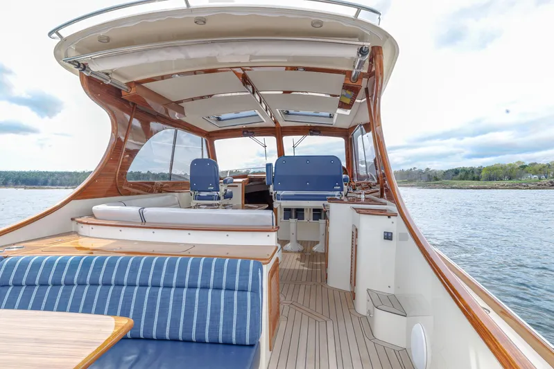 The Do-over Yacht Photos Pics 2024 Hinckley Picnic Boat 40 interior with elegant seating and wooden finishes on open water.