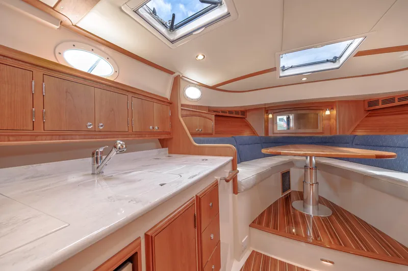 The Do-over Yacht Photos Pics 2024 Hinckley Picnic Boat 40 interior with elegant wood finish and skylights.