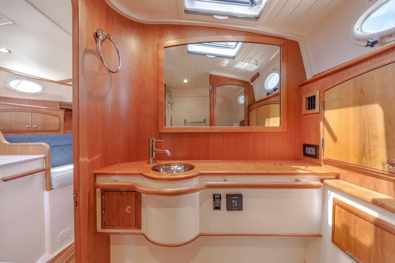The Do-over Yacht Photos Pics 2024 Hinckley Picnic Boat 40 interior with elegant wood finish and modern amenities.