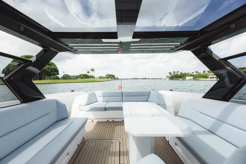 Shir Yacht Photos Pics Luxurious 2024 Vanquish 58 yacht interior with sleek seating and panoramic views.