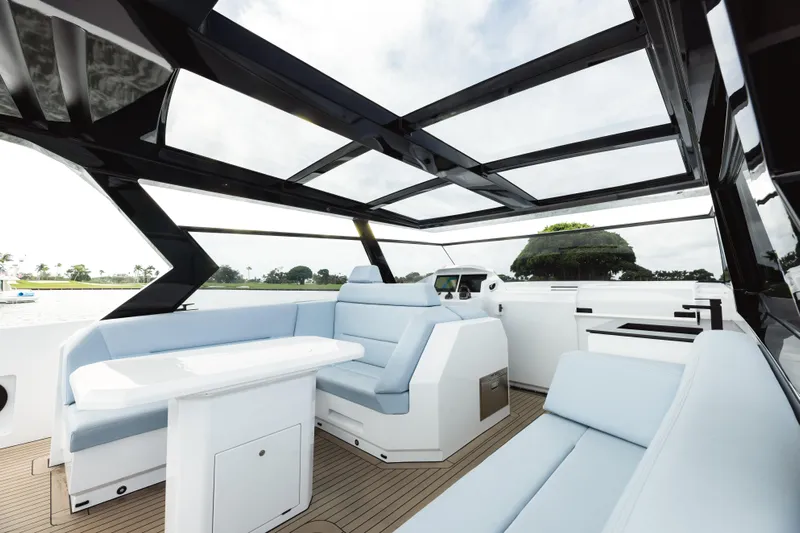 Shir Yacht Photos Pics Luxurious interior of 2024 Vanquish 58 yacht with sleek seating and panoramic views.