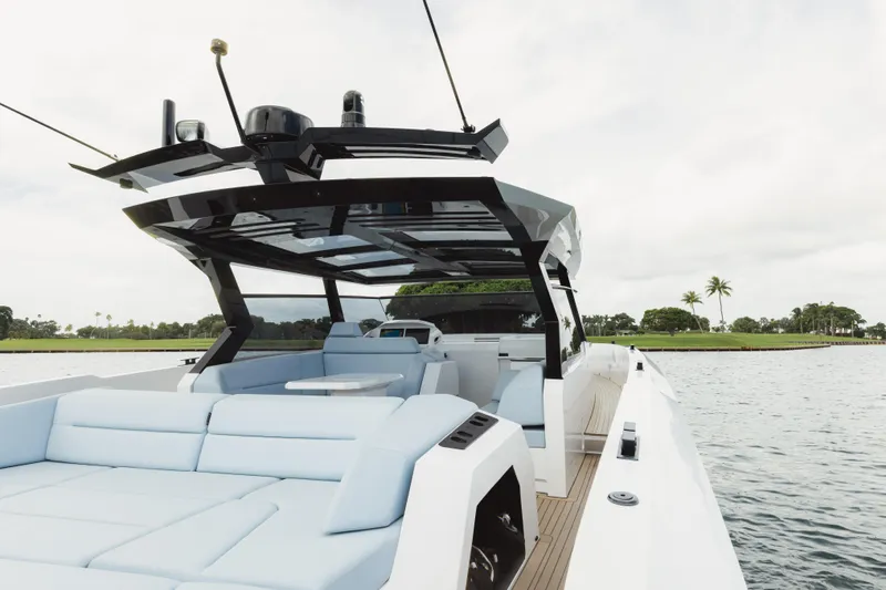 Shir Yacht Photos Pics 2024 Vanquish 58 yacht with sleek design and spacious deck on calm waters.