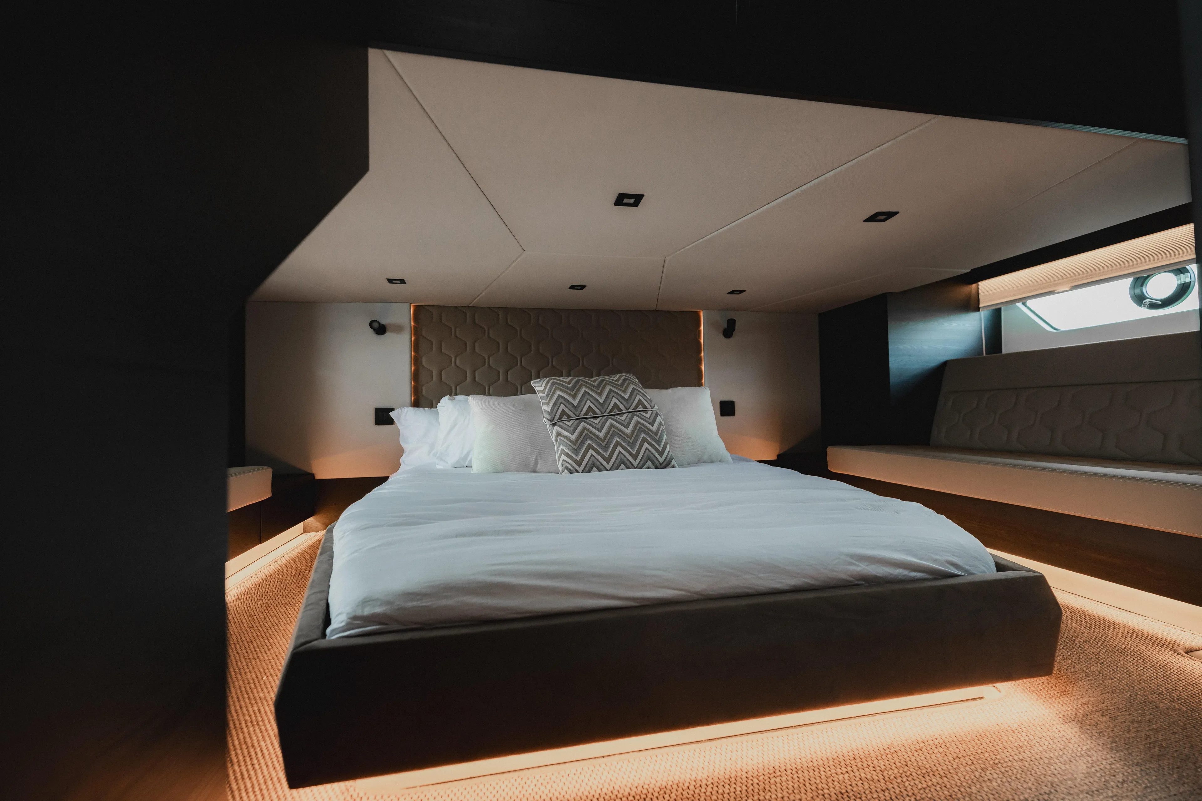 Shir Yacht Photos Pics Luxurious bedroom interior of 2024 Vanquish 58 yacht with modern design and ambient lighting.