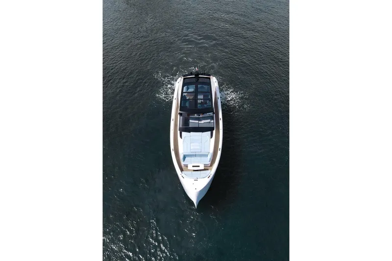Shir Yacht Photos Pics 2024 Vanquish 58 yacht cruising on open water, aerial view.