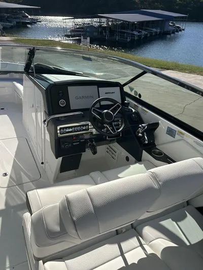 Only A Formula Yacht Photos Pics 2025 Formula 310 Bowrider boat interior with modern dashboard and lake view.