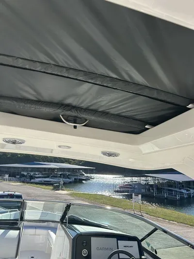 Only A Formula Yacht Photos Pics 2025 Formula 310 Bowrider boat interior with sunroof and Garmin navigation system.