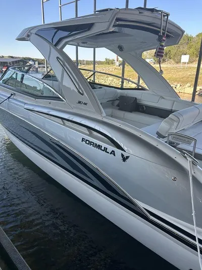 Only A Formula Yacht Photos Pics 2025 Formula 310 Bowrider boat docked, sleek design, silver finish, modern features.