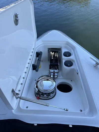 Only A Formula Yacht Photos Pics 2025 Formula 310 Bowrider anchor compartment with winch and storage features.