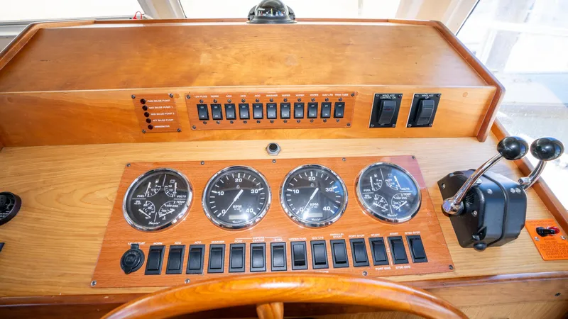 Temptation Yacht Photos Pics Control panel of 2005 Mainship 43 Trawler Aft Cabin with gauges and switches.