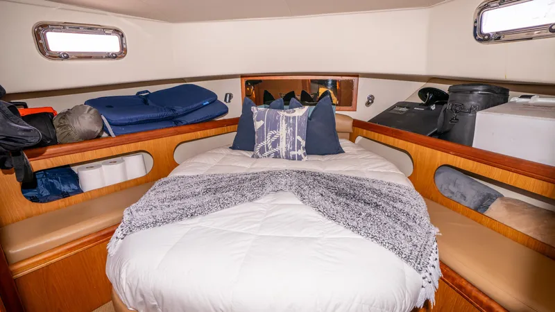 Temptation Yacht Photos Pics 2005 Mainship 43 Trawler Aft Cabin bedroom with cozy bedding and storage.
