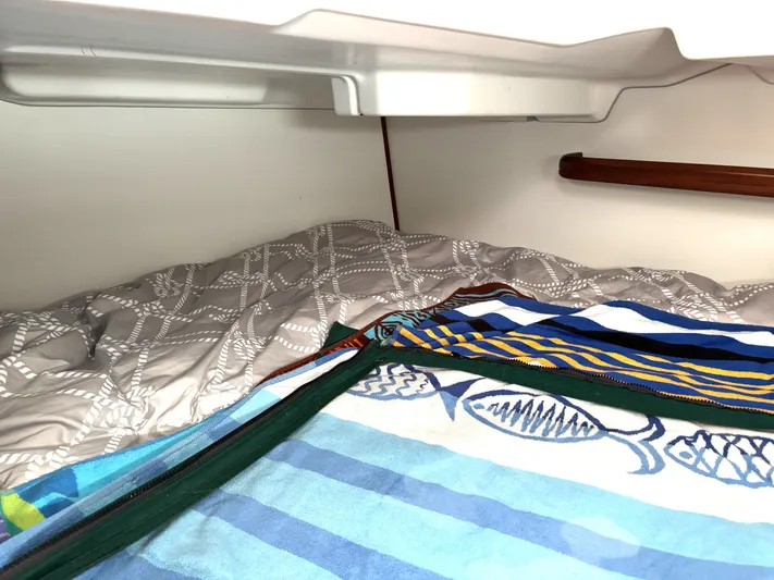 Windsome Yacht Photos Pics Cozy cabin interior of 2006 Beneteau Oceanis 373 sailboat with colorful bedding.