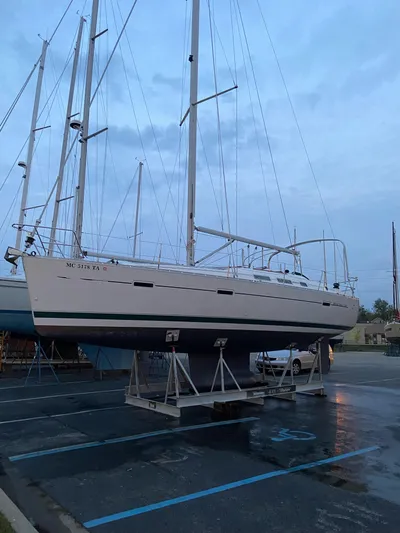 Windsome Yacht Photos Pics 2006 Beneteau Oceanis 373 sailboat on stands in a parking lot.