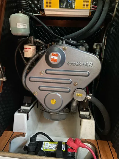 Windsome Yacht Photos Pics Yanmar engine in a 2006 Beneteau Oceanis 373 sailboat, showing detailed components and battery.