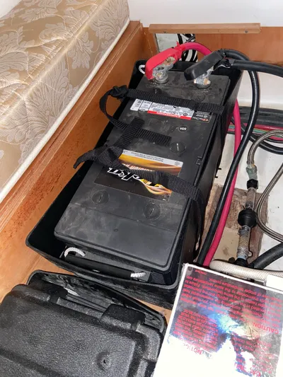 Windsome Yacht Photos Pics Battery compartment of a 2006 Beneteau Oceanis 373 sailboat, featuring secured wiring.