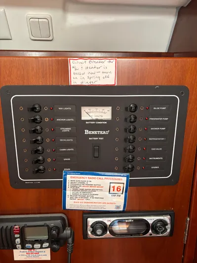 Windsome Yacht Photos Pics Electrical panel of a 2006 Beneteau Oceanis 373 sailboat with various switches and labels.