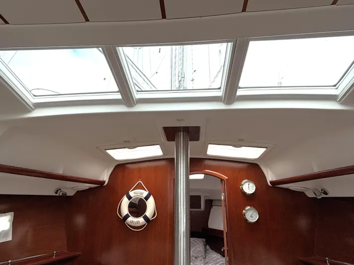 Windsome Yacht Photos Pics Interior of 2006 Beneteau Oceanis 373 sailboat with skylights and wooden finish.