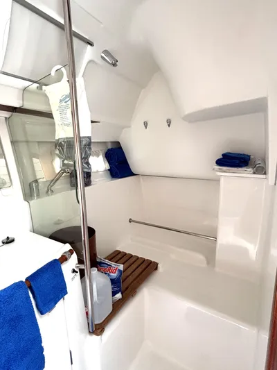 Windsome Yacht Photos Pics Interior of 2006 Beneteau Oceanis 373 sailboat bathroom with towels and toiletries.