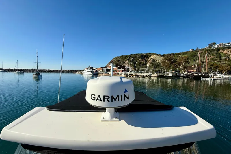 My Particular Harbor Yacht Photos Pics 2018 Regal 28 Express boat with Garmin equipment in a scenic marina setting.