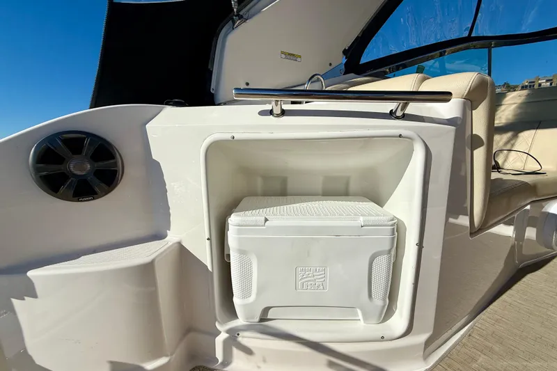 My Particular Harbor Yacht Photos Pics 2018 Regal 28 Express boat interior with cooler storage and speaker.