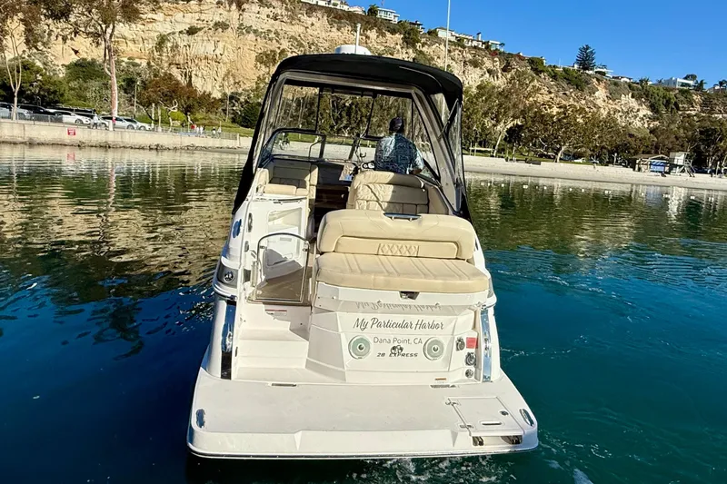 My Particular Harbor Yacht Photos Pics 2018 Regal 28 Express boat cruising in scenic coastal waters.