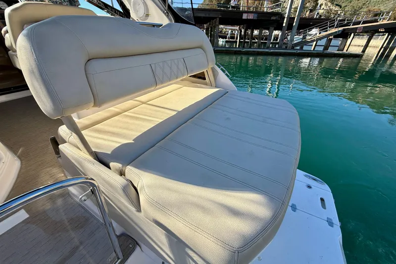 My Particular Harbor Yacht Photos Pics 2018 Regal 28 Express boat seat with beige upholstery by the water.