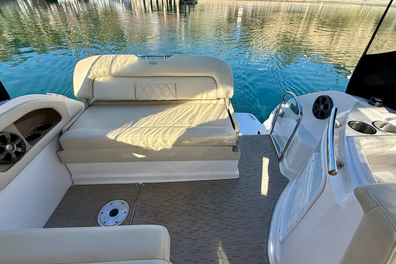 My Particular Harbor Yacht Photos Pics 2018 Regal 28 Express boat interior with seating, cup holders, and water view.