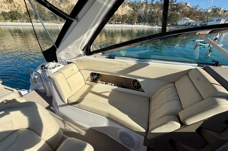 My Particular Harbor Yacht Photos Pics Luxurious interior of 2018 Regal 28 Express boat with beige seating and scenic water view.