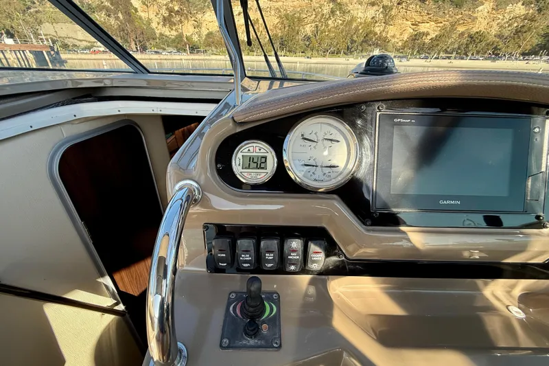 My Particular Harbor Yacht Photos Pics 2018 Regal 28 Express boat dashboard with Garmin GPS and control panel.