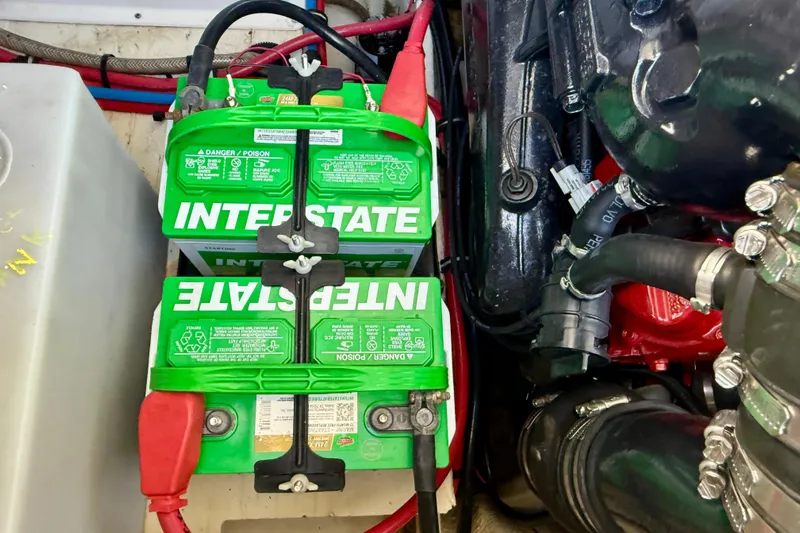My Particular Harbor Yacht Photos Pics Interstate batteries in 2018 Regal 28 Express engine compartment, showcasing wiring and components.