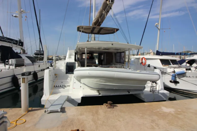  Yacht Photos Pics 2022 Bali 4.6 catamaran docked at marina, surrounded by other boats.