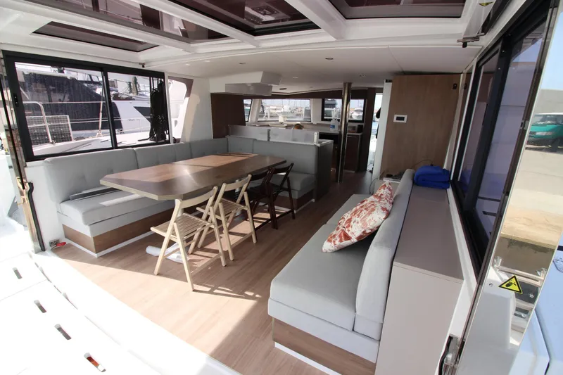  Yacht Photos Pics Luxurious interior of 2022 Bali 4.6 yacht with spacious seating and dining area.