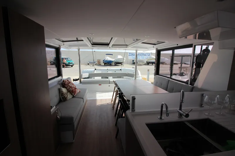  Yacht Photos Pics Interior of 2022 Bali 4.6 yacht with modern seating and kitchen area.
