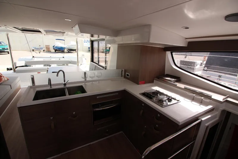 Yacht Photos Pics Modern kitchen interior of 2022 Bali 4.6 yacht with stove and sink.