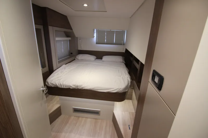  Yacht Photos Pics Modern bedroom interior in a 2022 Bali 4.6 yacht, featuring a cozy double bed.