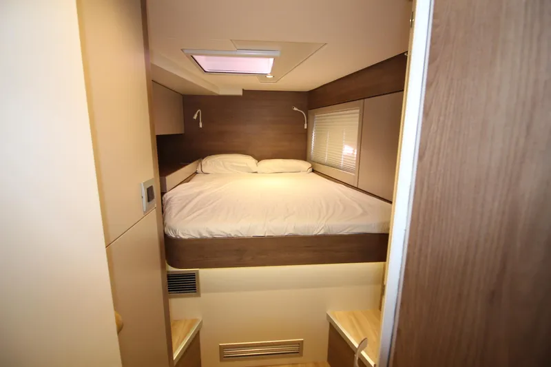  Yacht Photos Pics Cozy bedroom in 2022 Bali 4.6 yacht with modern wood accents and skylight.