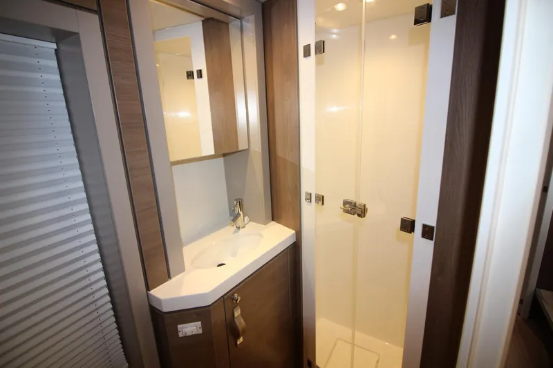  Yacht Photos Pics Modern bathroom in 2022 Bali 4.6 model, featuring sleek shower and vanity.