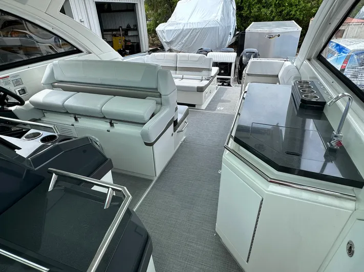  Yacht Photos Pics 2021 Formula 380 SSC boat interior with seating and kitchenette.