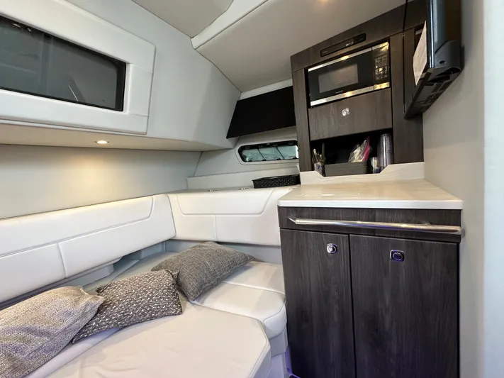  Yacht Photos Pics 2021 Formula 380 SSC cabin interior with modern kitchenette and cozy seating area.